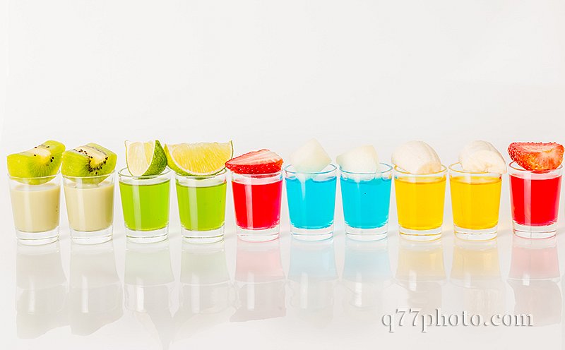 Color drinks in shot glass, blue, green, red, yellow and creamy 