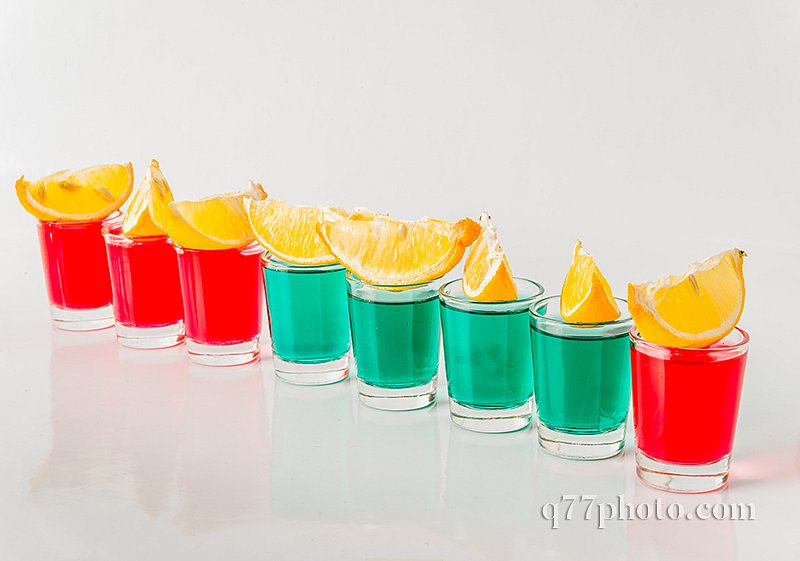 Glasses with green and red kamikaze, glamorous drinks, mixed dri
