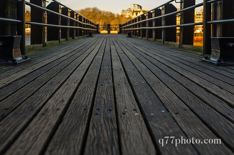 view on a wooden floor in a small pier on the river 